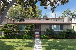 Sunnyvale apartment for rent - the front of a house with a lawn and trees