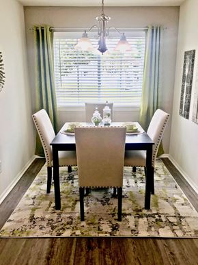 Chesapeake apartment for rent - a dining room with a table and chairs and a window