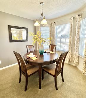 Virginia Beach apartment for rent - A dining room with a round table and chairs.