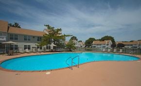 Virginia Beach apartment for rent - a large swimming pool with apartments in the background