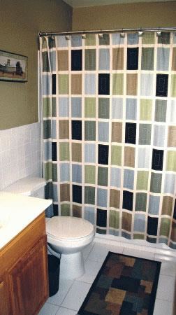 Ewing apartment for rent - a bathroom with a shower curtain and a toilet