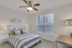 Greenwood Village apartment for rent - a bedroom with a bed and a ceiling fan