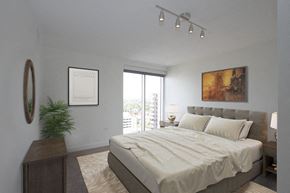 Denver apartment for rent - a bedroom with a large bed and a window