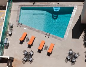 Denver apartment for rent - an aerial view of a pool with lounge chairs