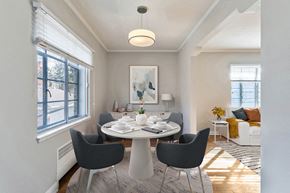 Denver apartment for rent - a dining room with a table and chairs and a large window