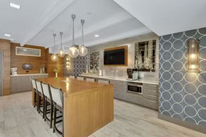 Denver apartment for rent - a kitchen with a large island and a table with chairs