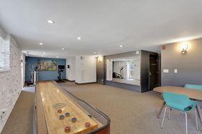 Denver apartment for rent - a game room with a shuffleboard table