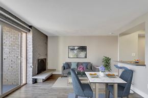 Denver apartment for rent - A dining room with a table set for two and a fireplace.