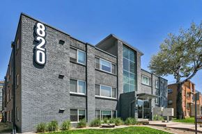 Denver apartment for rent - a brick building with a sign on the side of it