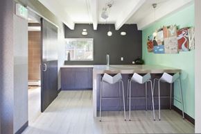 Denver apartment for rent - a kitchen with a bar and stools