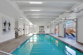 Denver apartment for rent - A large indoor swimming pool with a glass bottom.