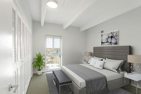 Denver apartment for rent - an image of a bedroom with a bed and a window