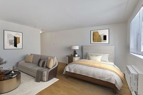Denver apartment for rent - a bedroom with a bed and a couch