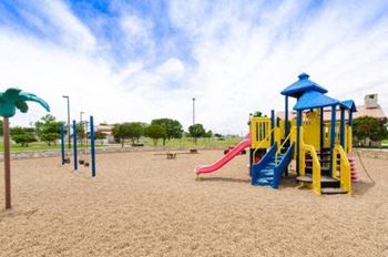 Playground area with colorful equipment and fitness stations