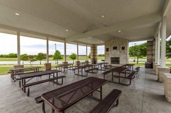 Covered outdoor pavilion with picnic tables