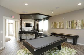 Gladstone townhouse for rent - a game room with a pool table and a bar