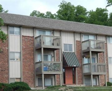 Liberty apartment for rent - a brick apartment building with balconies and trees