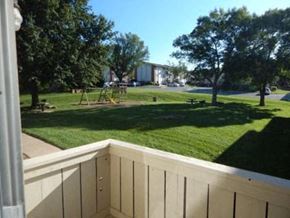 Liberty apartment for rent - a view of a backyard with a playground and trees