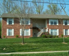 Liberty apartment for rent - a brick house with a tree in front of it