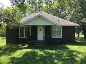 Shawnee apartment for rent - the front of a small brown house with a porch