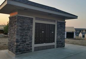Watford City apartment for rent - a small brick building with a garage door