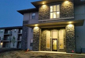 Watford City apartment for rent - the front of a building with lights on it