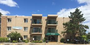 Anoka apartment for rent - an apartment building with a truck parked in front of it