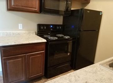 Anoka apartment for rent - a kitchen with a stove and a refrigerator