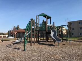 Anoka apartment for rent - a playground with two slides and a pavilion