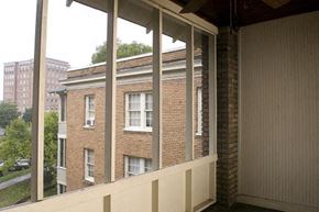 Birmingham apartment for rent - A view of a building through a window.