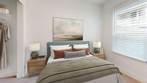 Costa Mesa apartment for rent - A bedroom with a large bed and a painting on the wall.