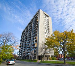 Ottawa apartment for rent - a tall building with balconies on the side of a street