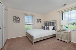 Clinton Township apartment for rent - a bedroom with a bed and two windows