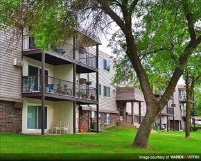 Shoreview apartment for rent - a row of houses with balconies and trees