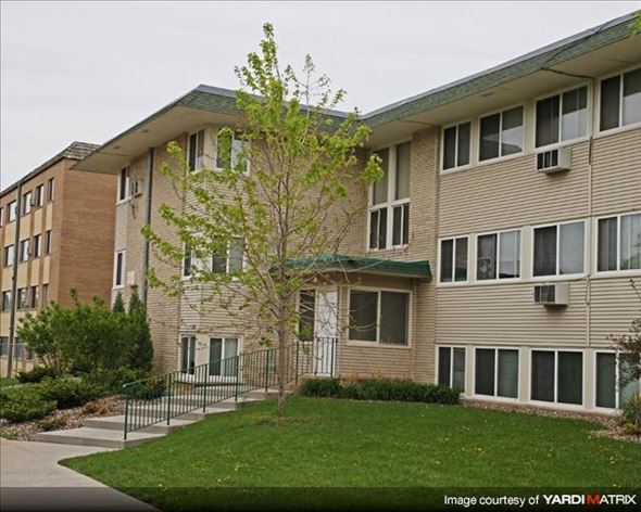 St. Paul apartment for rent - an apartment building with a lawn and a tree