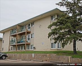 St. Paul apartment for rent - a large apartment building with a tree in front of it