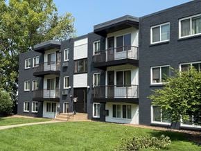 Columbia apartment for rent - A modern apartment building with balconies and doors.