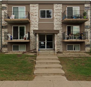 Anoka apartment for rent - the front of an apartment building with steps to the door