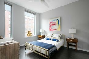 New Orleans apartment for rent - a bedroom with a bed and two windows