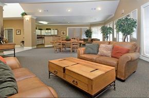 Weatherford apartment for rent - A living room with brown leather couches and a wooden coffee table.