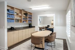 Gainesville townhouse for rent - A kitchen with a table and chairs in the middle of the room.