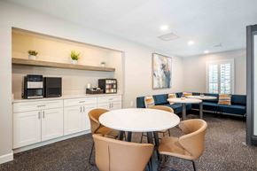 Gainesville townhouse for rent - a dining room with a table and chairs and a microwave