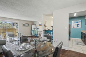 Winter Park apartment for rent - A dining room with a glass table and chairs.