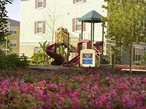 Orlando apartment for rent - a playground with a slide in front of a house