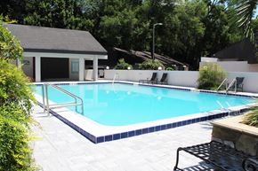 Gainesville townhouse for rent - a swimming pool in front of a house