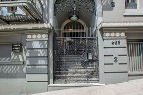 San Francisco apartment for rent - A wrought iron gate blocks the entrance to a building with the number 603 on the wall.