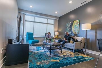 Grand Rapids apartment for rent - two people sitting on a couch in a living room