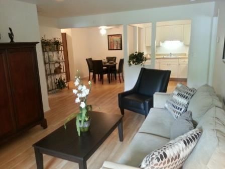 Detroit apartment for rent - A living room with a black coffee table and a grey sofa.