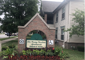 Detroit apartment for rent - a brick monument sign in front of a house