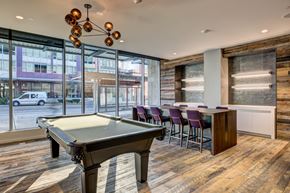 Seattle apartment for rent - a game room with a pool table and a bar